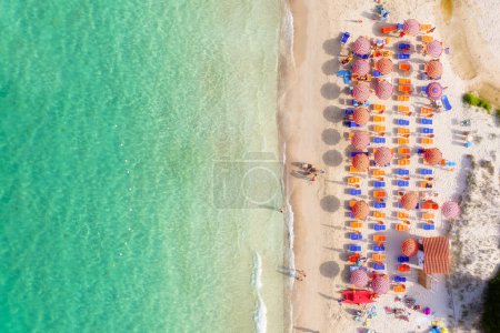 Photo for Aerial view on beach, people and umbrellas. Vacation and adventure. Europe, Mediterranean Sea. Top view from drone at beach and azure sea. View on the coast from drone. - Royalty Free Image