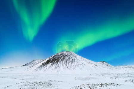 Photo for Aurora Borealis. Northern Lights over the mountains. Scandinavia. Winter night landscape with bright lights in the sky. Landscape in the north in winter time. - Royalty Free Image
