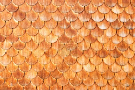 Photo for Wood trim for the house. Wooden products. Natural and ecological materials. Ornament and composition. Background and wallpaper. Decor on the wall of the house. Natural and ecological materials. - Royalty Free Image
