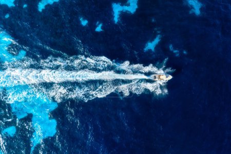 Photo for Vacation and leisure. Aerial view on fast boat on blue Mediterranean sea at sunny day. Fast ship on the sea surface. Seascape from the drone. Seascape from air. Seascape with motorboat. - Royalty Free Image