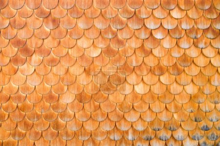 Photo for Wood trim for the house. Wooden products. Natural and ecological materials. Ornament and composition. Background and wallpaper. Decor on the wall of the house. Natural and ecological materials. - Royalty Free Image