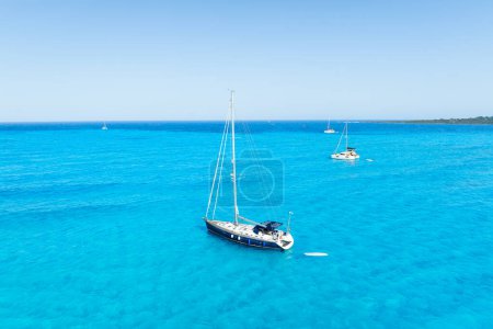 Photo for Drone view of a sailing yacht. Vacationing people. Vacation and holidays. Summer time for sea travel. The sea bay. Photo for background and wallpaper. Mediterranean Sea. - Royalty Free Image