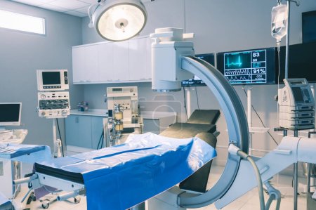 Empty operating room with bed and medical equipped in a hospital