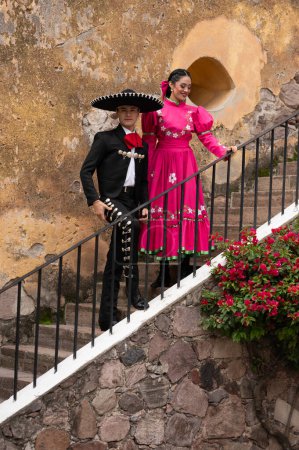 Photo for Young hispanic woman and man in independence day or cinco de mayo parade or cultural Festival - Royalty Free Image