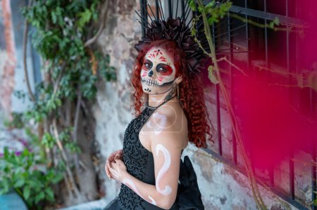 Photo for Closeup portrait of Calavera Catrina. Young woman with sugar skull makeup. Dia de los muertos. Day of The Dead. Halloween. - Royalty Free Image