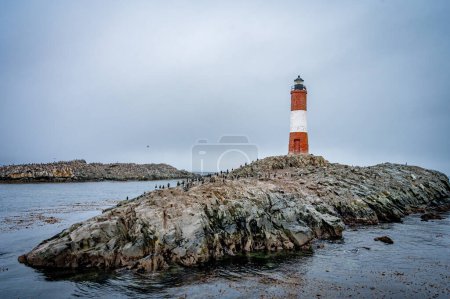 Lighthouse end of world, Canal Beagle, Ushuaia, Argentina with penguins and sea 