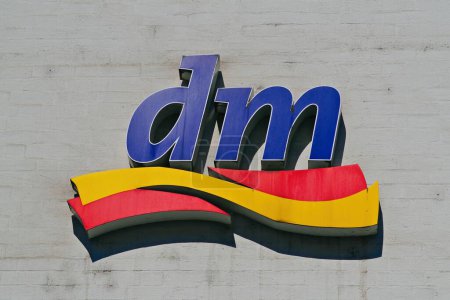 Ulm, Baden-wuerttemberg, Germany - May 31, 2023:: Logo of DM drug store in Ulm, Germany. DM is a German drugstore chain.