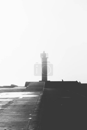 Lighthouse on south pier in Riga, photo taken on a foggy day