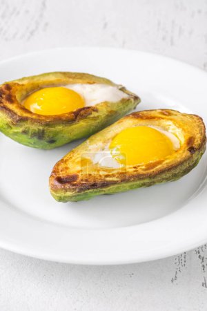 Photo for Baked eggs in avocado - Royalty Free Image