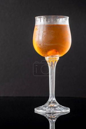 Glass of Waterloo cocktail on the black background