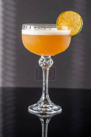 Photo for Hoyt's Daiquiri cocktail garnished with seared lime wheel - Royalty Free Image