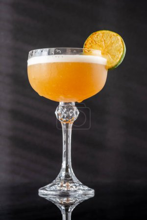 Photo for Hoyt's Daiquiri cocktail garnished with seared lime wheel - Royalty Free Image