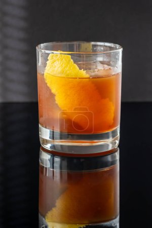 Photo for Hunter's tea cocktail garnished with lemon zest - Royalty Free Image