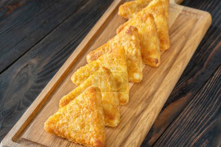 Hash Browns triangle patties on the cutting board