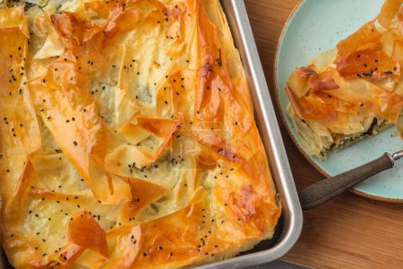 Spinach and feta pie in filo pastry. Crispy spinach feta cheese phyllo pastry pie