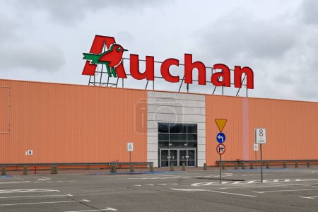 Photo for Rumia, Poland - April 16, 2023: Auchan logo on the facade of the store. Auchan is a French hypermarket chain - Royalty Free Image