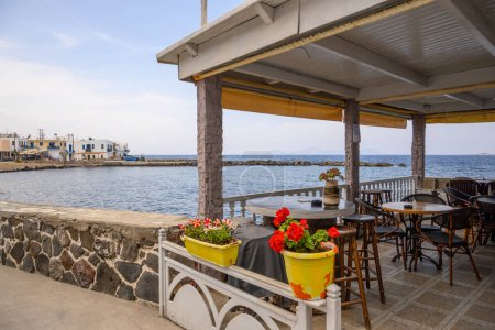Photo for Nisyros, Greece - May 10, 2023: Seaside restaurant in Mandraki on the island of Nisyros. Dodecanese, Greece - Royalty Free Image