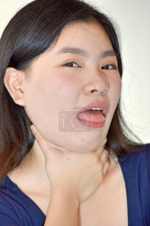 Photo for A Pretty Diverse Adult Female Choking - Royalty Free Image