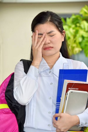Photo for Cute Chinese Girl Student Under Stress With Notebooks - Royalty Free Image