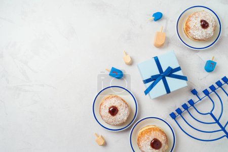 Photo for Background with traditional donuts, menorah and gift box.  Hanukkah holiday concept. Top view, flat lay - Royalty Free Image