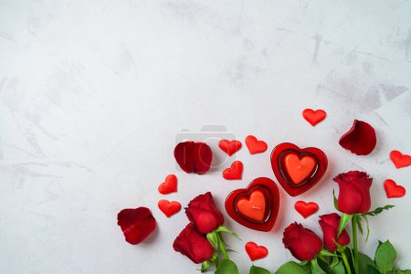 Foto de Happy Valentine's day  background with heart shape candle and rose flowers. Top view, flat lay - Imagen libre de derechos