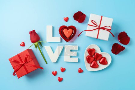 Photo pour Happy Valentine's day creative background with love letter, heart shape candle and gift boxes. Top view, flat lay - image libre de droit