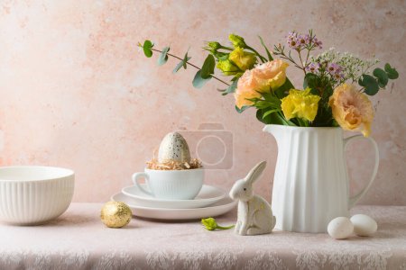 Photo for Easter holiday celebration with flowers bouquet and Easter eggs decoration on table over bright  background - Royalty Free Image