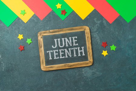 Photo for Juneteenth USA holiday background with colorful paper, balckboard and stars. Top view, flat lay - Royalty Free Image