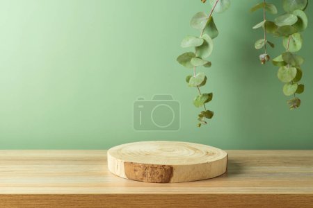 Photo for Empty wooden podium log on table over green leaves background. Cosmetic mock up for design and product display - Royalty Free Image