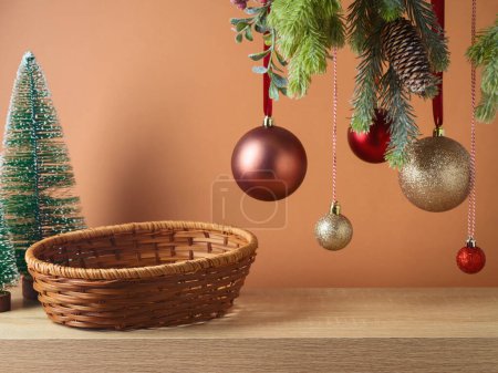 Photo for Empty basket on wooden table with hanging ornamnrt decoration background. Christmas mock up for design and product display. - Royalty Free Image
