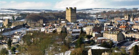 Photo for Richmond, North Yorkshire lightly covered in snow with Richmond Castle in the centre - Royalty Free Image