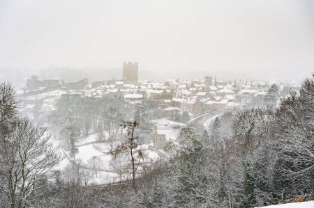 Photo for Snow falling on Richmond Castle and Richmond Town, North Yorkshire - Royalty Free Image