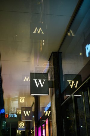 Photo for LONDON - November 12, 2022: The illuminated Waterstones sign beckons book lovers to explore the store's offerings. - Royalty Free Image