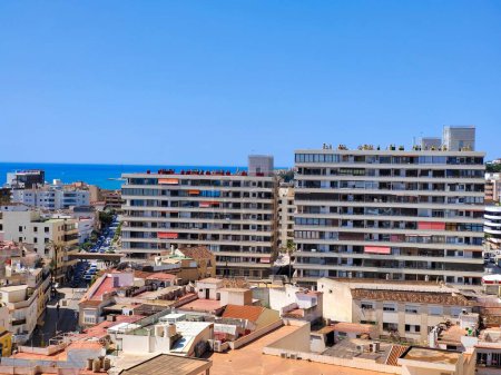 Photo for Torremolinos, Spain - May 2022. PAerial view of spanish city in the coast of Mediterranean sea with the beach in the background in the summer time - Royalty Free Image