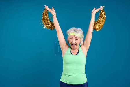 Excited Senior Celebrating with Cheer Accessories