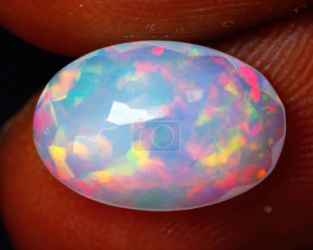 Foto de Natural gemstone noble opal on a black background - Imagen libre de derechos