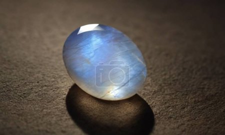 Photo for Natural precious moonstone on a brown background. Natural stone adularia - Royalty Free Image