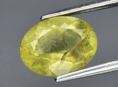 Photo for Natural yellow beryl gem on the background - Royalty Free Image