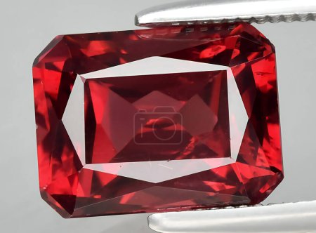 Photo for Natural red rhodolite gem on the background - Royalty Free Image