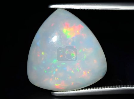 natural rainbow multicolor opal gem on background