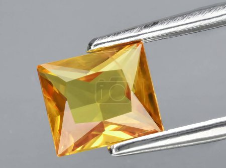 natural yellow sapphire gem on background