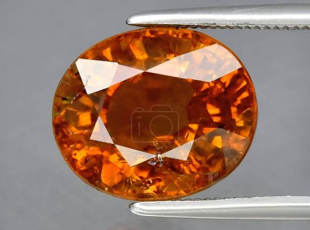 Photo for Natural orange tourmaline dravite gem on background - Royalty Free Image