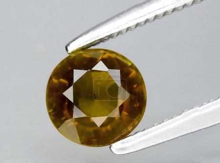 Photo for Natural orange tourmaline dravite gem on background - Royalty Free Image