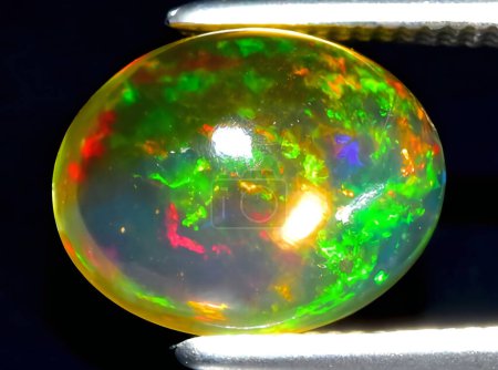 natural rainbow multi color opal gem on background