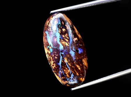 Photo for Natural multicolor boulder opal gem on background - Royalty Free Image