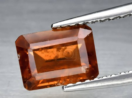 Photo for Natural orange hessonite garnet gem on background - Royalty Free Image