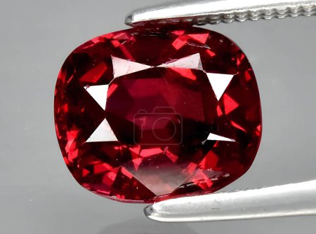 natural red rhodolite garnet gem on background