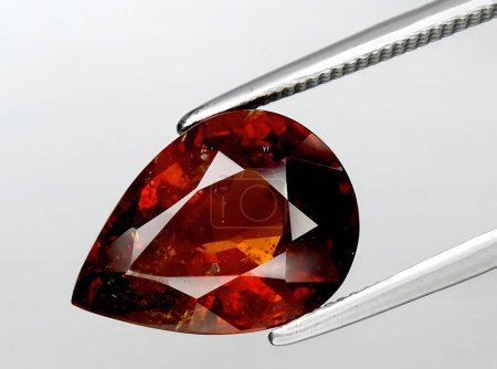 Photo for Natural orange spessartite garnet gem on background - Royalty Free Image