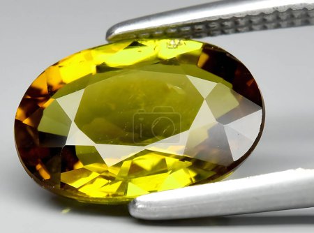 Photo for Natural yellow tourmaline gem on background - Royalty Free Image