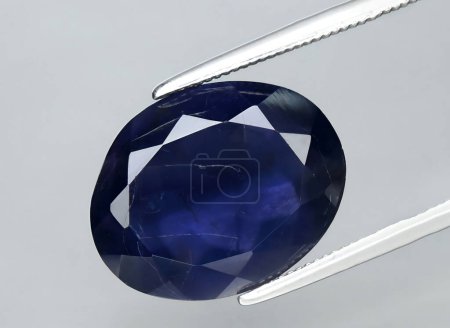 Photo for Natural blue iolite gem on background - Royalty Free Image